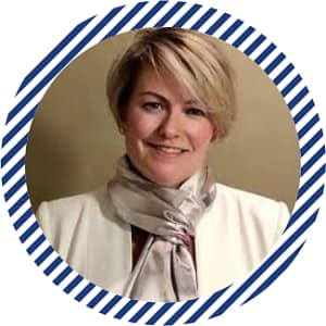 Smiling woman with short blonde hair